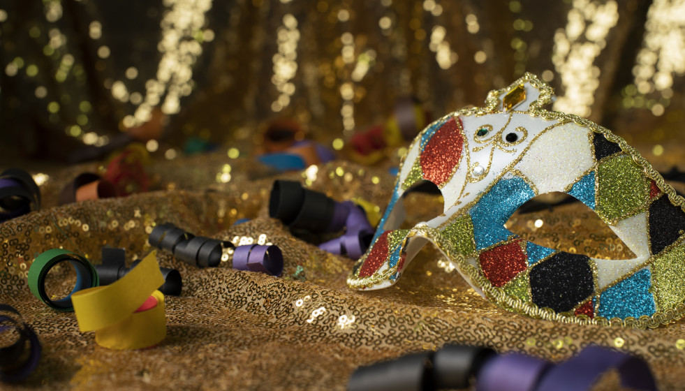 Carnival mask surrounded by confetti
