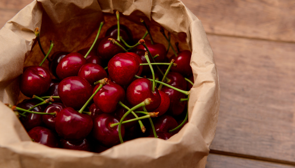 Cherries craft paper package wooden table
