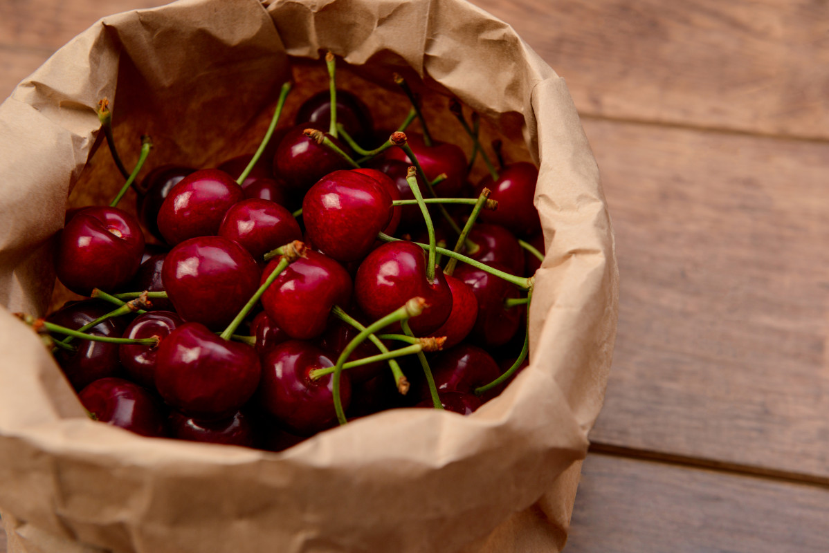 Cherries craft paper package wooden table